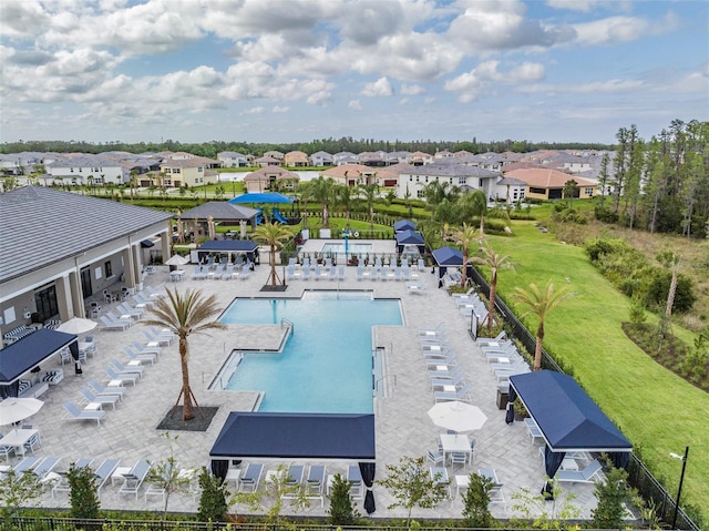 3197 Acacia Bay Ave, Wesley Chapel, FL 33543 - community pool with a residential view and a patio