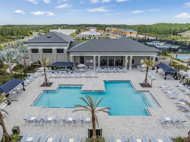 3197 Acacia Bay Ave, Wesley Chapel, FL 33543 - community pool featuring a patio area