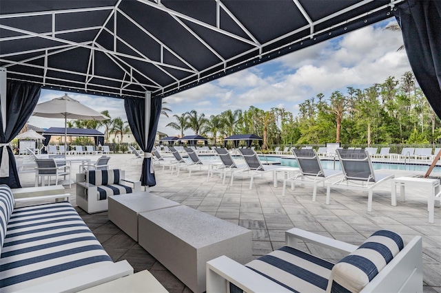 3197 Acacia Bay Ave, Wesley Chapel, FL 33543 - view of patio / terrace with an outdoor living space, a gazebo, and a community pool