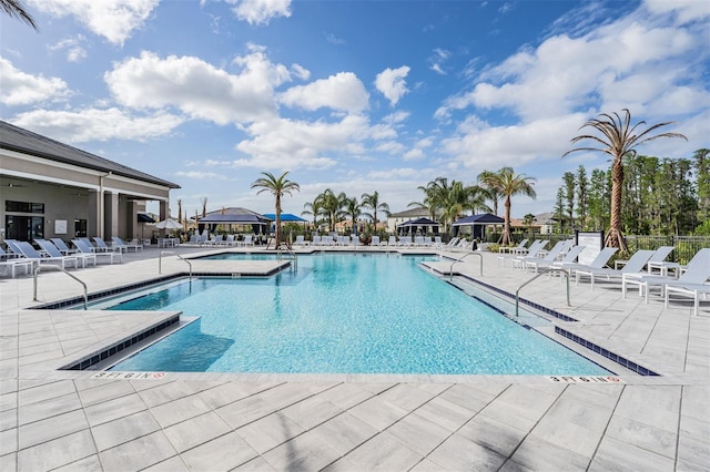 3197 Acacia Bay Ave, Wesley Chapel, FL 33543 - community pool with a patio area