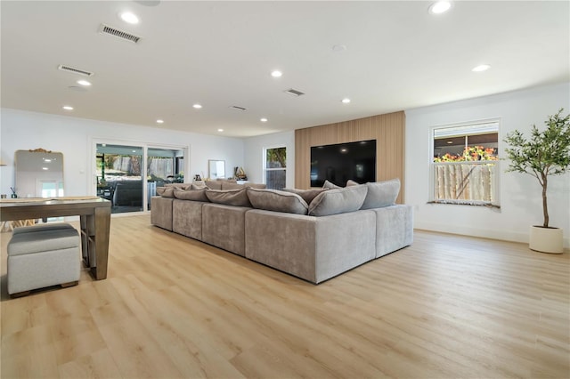 711 N Indian River Dr, Cocoa, FL 32922 - living room featuring light wood-type flooring, recessed lighting, plenty of natural light, and baseboards