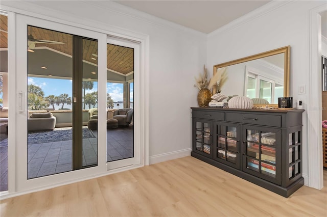 711 N Indian River Dr, Cocoa, FL 32922 - entryway with wood finished floors, ornamental molding, and baseboards