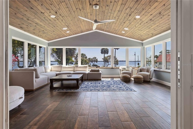 711 N Indian River Dr, Cocoa, FL 32922 - sunroom with crown molding, lofted ceiling, baseboards, a water view, and hardwood / wood-style flooring