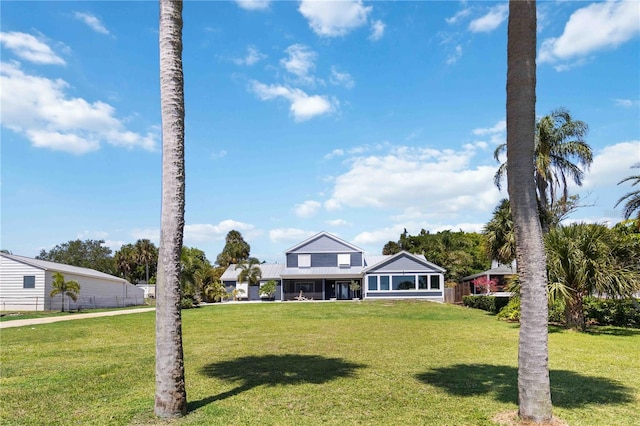 711 N Indian River Dr, Cocoa, FL 32922 - view of front of property featuring a front lawn and metal roof