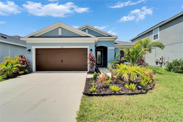5415 Limelight Dr, Apollo Beach, FL 33572 - ranch-style house featuring a garage, stucco siding, driveway, and a front yard