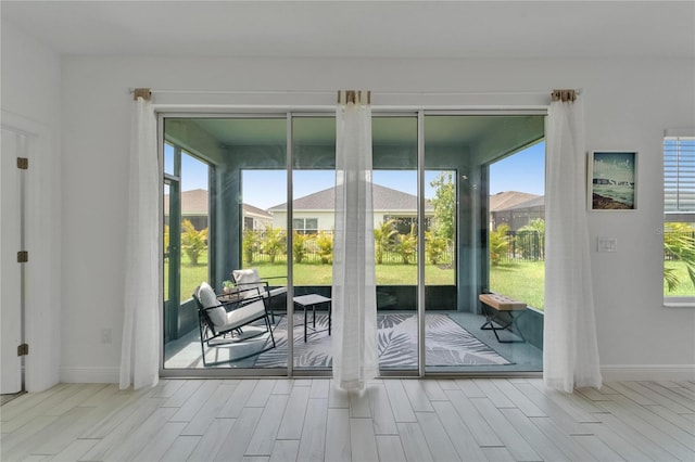 5415 Limelight Dr, Apollo Beach, FL 33572 - doorway to outside featuring healthy amount of natural light and wood tiled floors