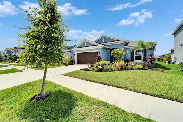 5415 Limelight Dr, Apollo Beach, FL 33572 - single story home featuring driveway, a garage, a front yard, and stucco siding