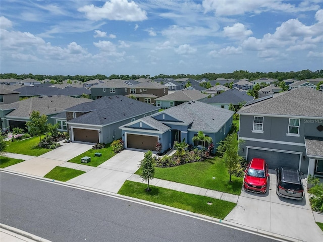 5415 Limelight Dr, Apollo Beach, FL 33572 - view of front facade with a residential view, driveway, and stucco siding
