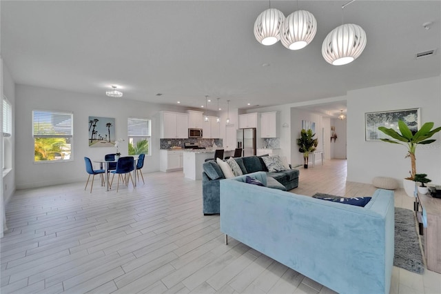 5415 Limelight Dr, Apollo Beach, FL 33572 - living room with light wood-style flooring