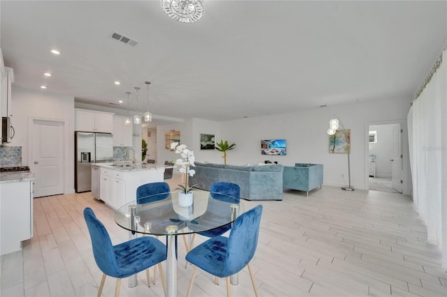 5415 Limelight Dr, Apollo Beach, FL 33572 - dining area with recessed lighting and light wood-style floors