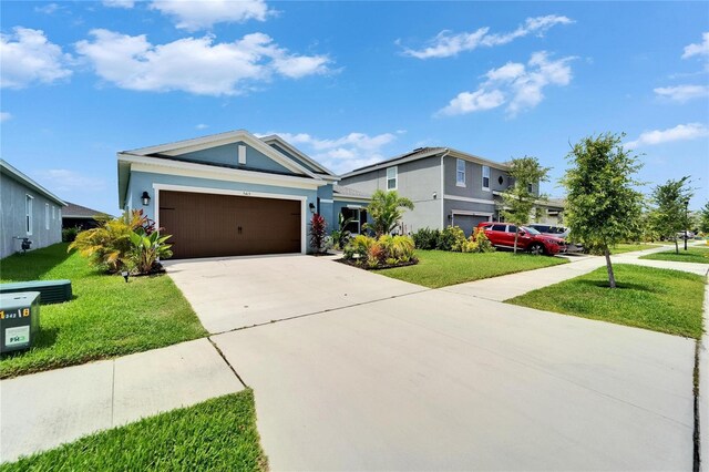 5415 Limelight Dr, Apollo Beach, FL 33572 - single story home with concrete driveway, stucco siding, and a front yard