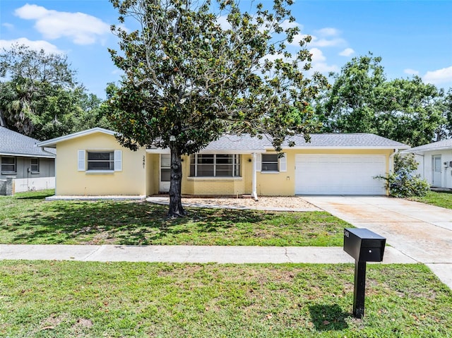 2481 12th Ave SW, Largo, FL 33770 - ranch-style house with a garage, a front lawn, and driveway
