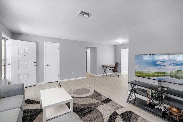 2481 12th Ave SW, Largo, FL 33770 - living area featuring light wood-style floors
