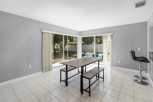 2481 12th Ave SW, Largo, FL 33770 - dining area featuring baseboards and light tile patterned floors