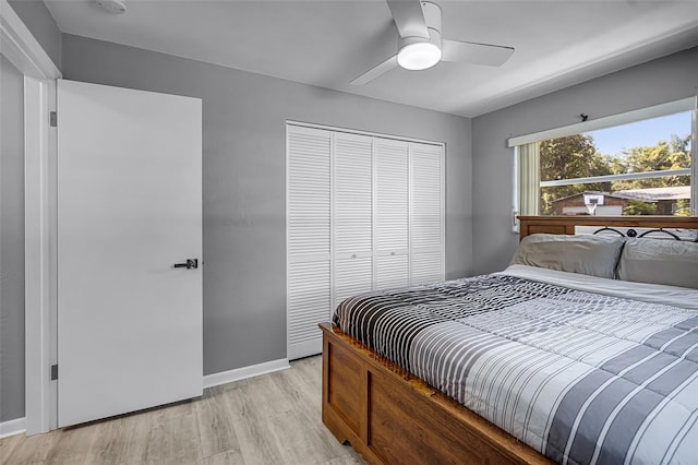 2481 12th Ave SW, Largo, FL 33770 - bedroom featuring a closet, light wood-style floors, and a ceiling fan