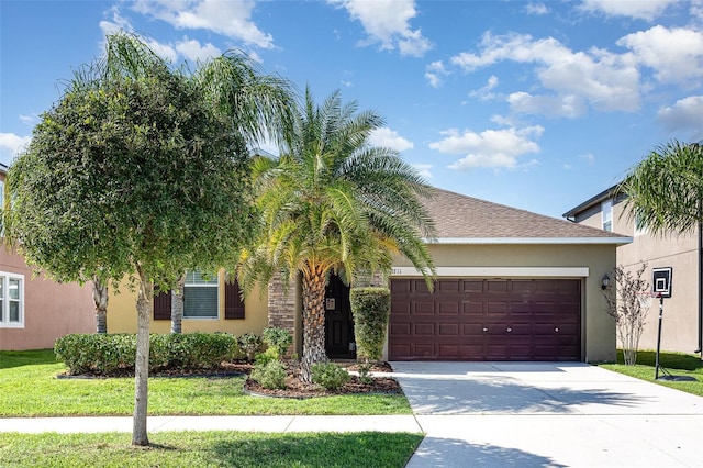 11711 Winterset Cove Dr, Riverview, FL 33579 - obstructed view of property featuring stucco siding, an attached garage, driveway, and a front yard