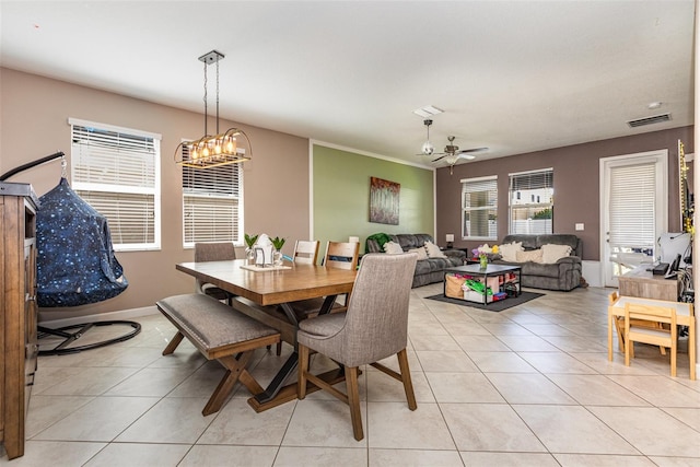 11711 Winterset Cove Dr, Riverview, FL 33579 - dining area featuring light tile patterned floors, a chandelier, and ceiling fan