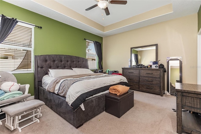 11711 Winterset Cove Dr, Riverview, FL 33579 - bedroom featuring light colored carpet, a ceiling fan, and a tray ceiling