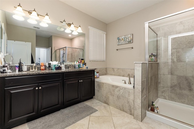 11711 Winterset Cove Dr, Riverview, FL 33579 - bathroom featuring a shower stall, double vanity, a bath, and tile patterned floors