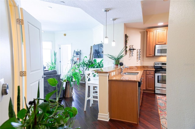 1209 E Cumberland Ave Unit 1003, Tampa, FL 33602 - kitchen with stainless steel electric range, a peninsula, dark wood finished floors, light stone counters, and ornamental molding