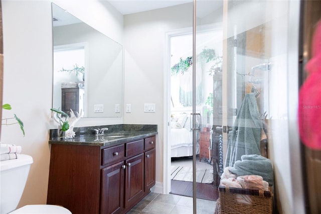 1209 E Cumberland Ave Unit 1003, Tampa, FL 33602 - ensuite bathroom featuring vanity, a shower with door, and tile patterned floors