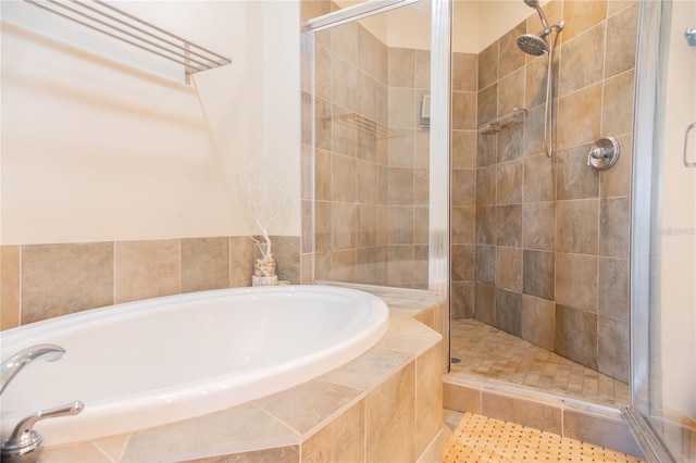 1209 E Cumberland Ave Unit 1003, Tampa, FL 33602 - bathroom featuring a bath and a shower stall