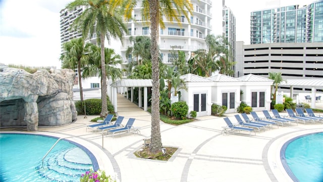 1209 E Cumberland Ave Unit 1003, Tampa, FL 33602 - community pool with french doors and a patio area