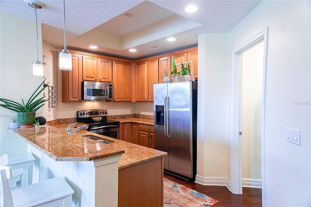 1209 E Cumberland Ave Unit 1003, Tampa, FL 33602 - kitchen featuring stainless steel appliances, a peninsula, recessed lighting, light stone countertops, and dark wood finished floors