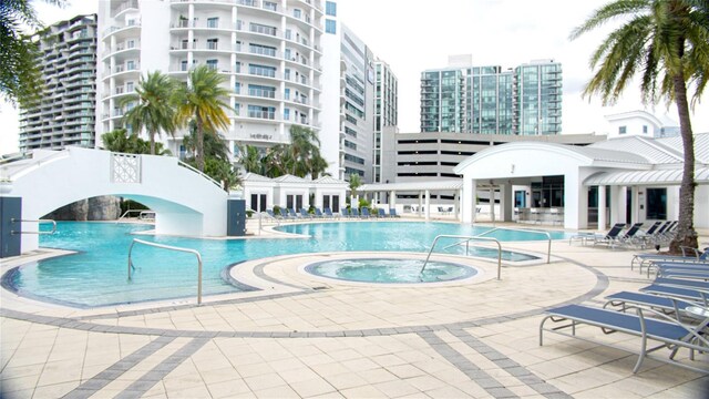 1209 E Cumberland Ave Unit 1003, Tampa, FL 33602 - community pool featuring a patio and a hot tub