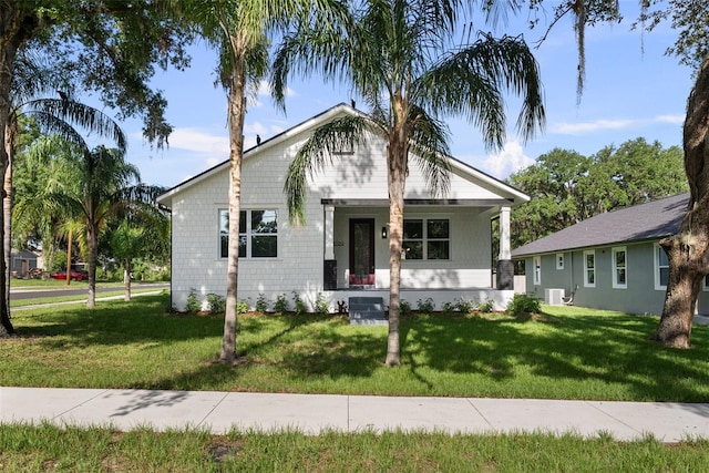 5709 N 20th St, Tampa, FL 33610 - view of front of property with a front lawn and covered porch
