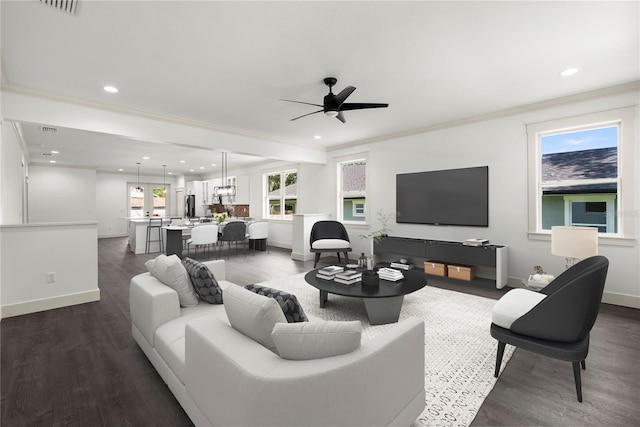 5709 N 20th St, Tampa, FL 33610 - living room featuring a ceiling fan, dark wood finished floors, recessed lighting, and ornamental molding