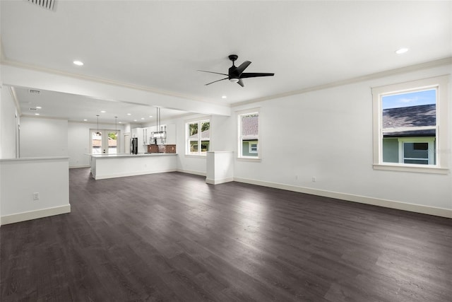 5709 N 20th St, Tampa, FL 33610 - unfurnished living room featuring a ceiling fan, crown molding, recessed lighting, and dark wood-style flooring