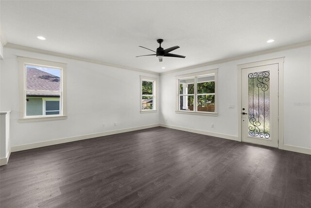 5709 N 20th St, Tampa, FL 33610 - foyer entrance featuring a ceiling fan, ornamental molding, dark wood-style floors, and recessed lighting