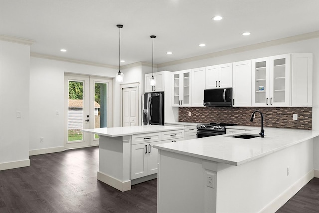 5709 N 20th St, Tampa, FL 33610 - kitchen featuring refrigerator with ice dispenser, black microwave, electric stove, tasteful backsplash, and ornamental molding