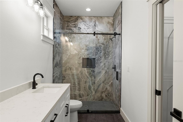 5709 N 20th St, Tampa, FL 33610 - full bath with a marble finish shower, vanity, and wood finished floors