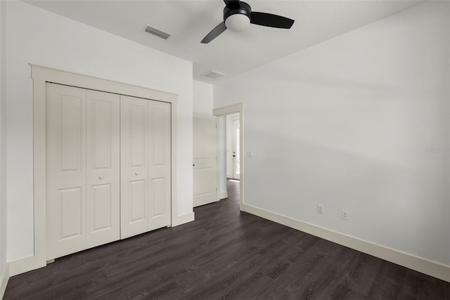 5709 N 20th St, Tampa, FL 33610 - unfurnished bedroom with dark wood-style floors, a closet, and ceiling fan