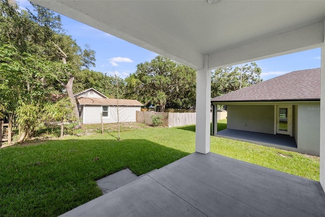 5709 N 20th St, Tampa, FL 33610 - view of yard featuring a patio and an outbuilding
