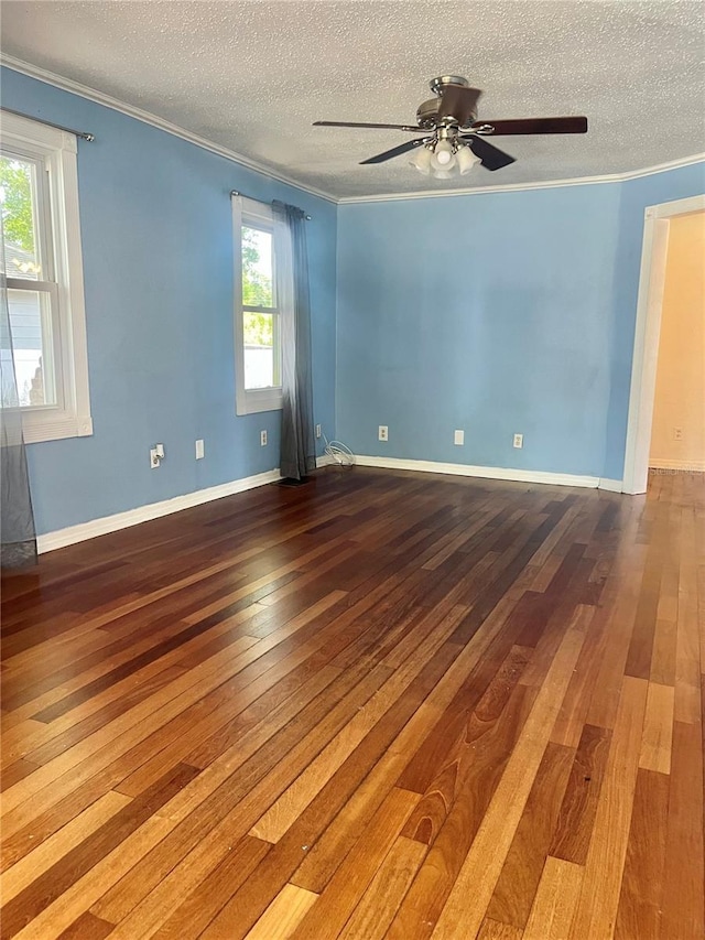 4634 Iris St N, Saint Petersburg, FL 33714 - unfurnished room featuring ornamental molding, hardwood / wood-style flooring, a textured ceiling, ceiling fan, and baseboards