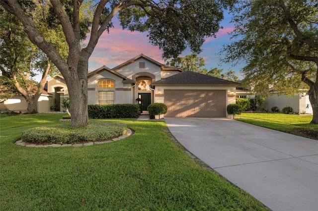 2043 Wrangler Dr, Brandon, FL 33511 - single story home featuring stucco siding, a garage, concrete driveway, and a yard