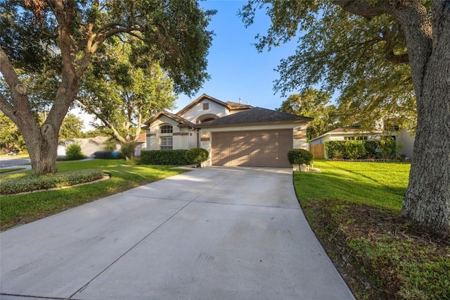 2043 Wrangler Dr, Brandon, FL 33511 - ranch-style house with concrete driveway, an attached garage, a front lawn, and stucco siding