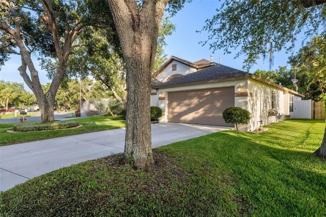 2043 Wrangler Dr, Brandon, FL 33511 - view of front of house featuring concrete driveway, an attached garage, stucco siding, and a shingled roof