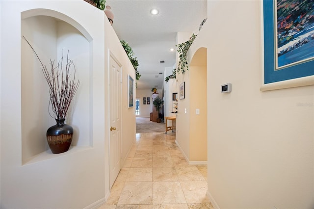 2043 Wrangler Dr, Brandon, FL 33511 - hall featuring baseboards, arched walkways, and recessed lighting
