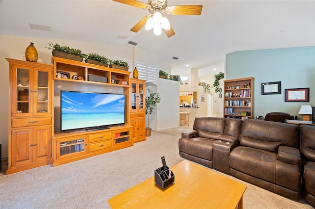 2043 Wrangler Dr, Brandon, FL 33511 - living area with light colored carpet, vaulted ceiling, and a ceiling fan