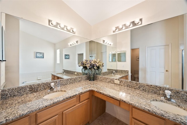 2043 Wrangler Dr, Brandon, FL 33511 - full bathroom featuring double vanity, a garden tub, high vaulted ceiling, toilet, and tile patterned floors