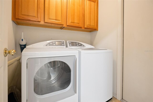 2043 Wrangler Dr, Brandon, FL 33511 - laundry room featuring washing machine and clothes dryer and cabinet space