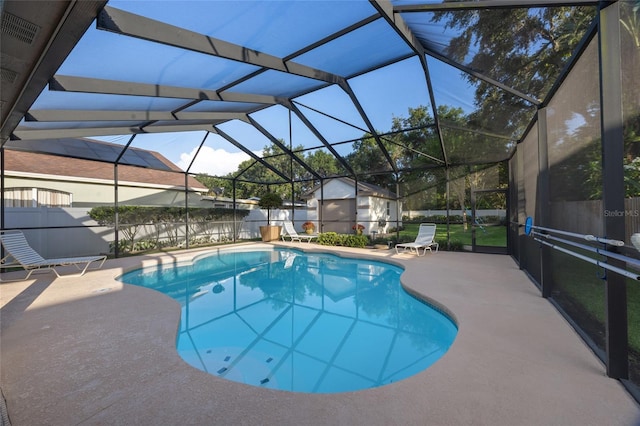 2043 Wrangler Dr, Brandon, FL 33511 - view of swimming pool featuring a patio, a fenced backyard, and a lanai