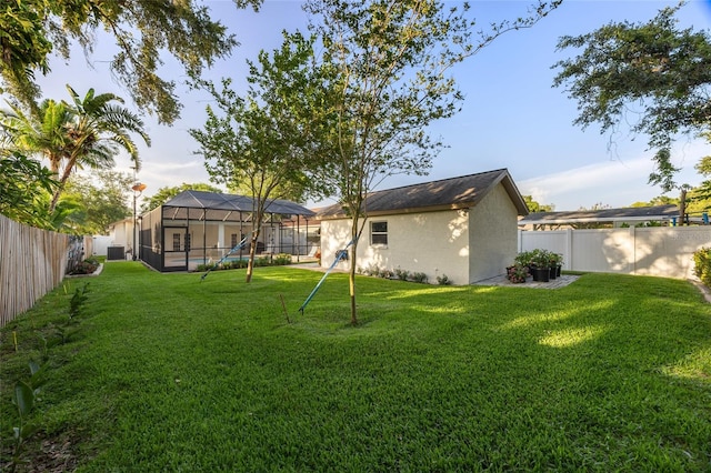 2043 Wrangler Dr, Brandon, FL 33511 - view of yard with a lanai and central AC unit