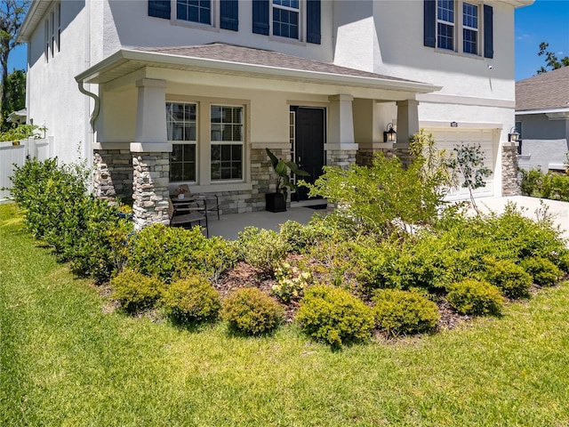 8423 Praise Dr, Tampa, FL 33625 - view of front of property with a garage, stucco siding, and stone siding