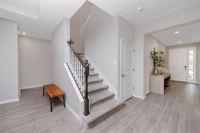8423 Praise Dr, Tampa, FL 33625 - entrance foyer with light wood-style floors, stairway, baseboards, and recessed lighting