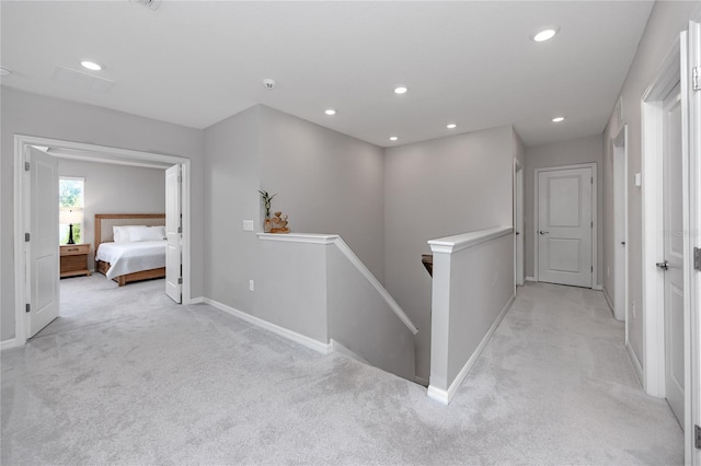 8423 Praise Dr, Tampa, FL 33625 - corridor featuring an upstairs landing, light carpet, baseboards, and recessed lighting